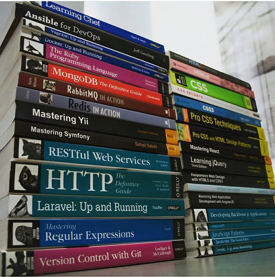 Stack of programming books getting praised on Twitter